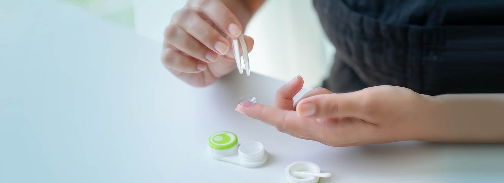finger with contact lenses