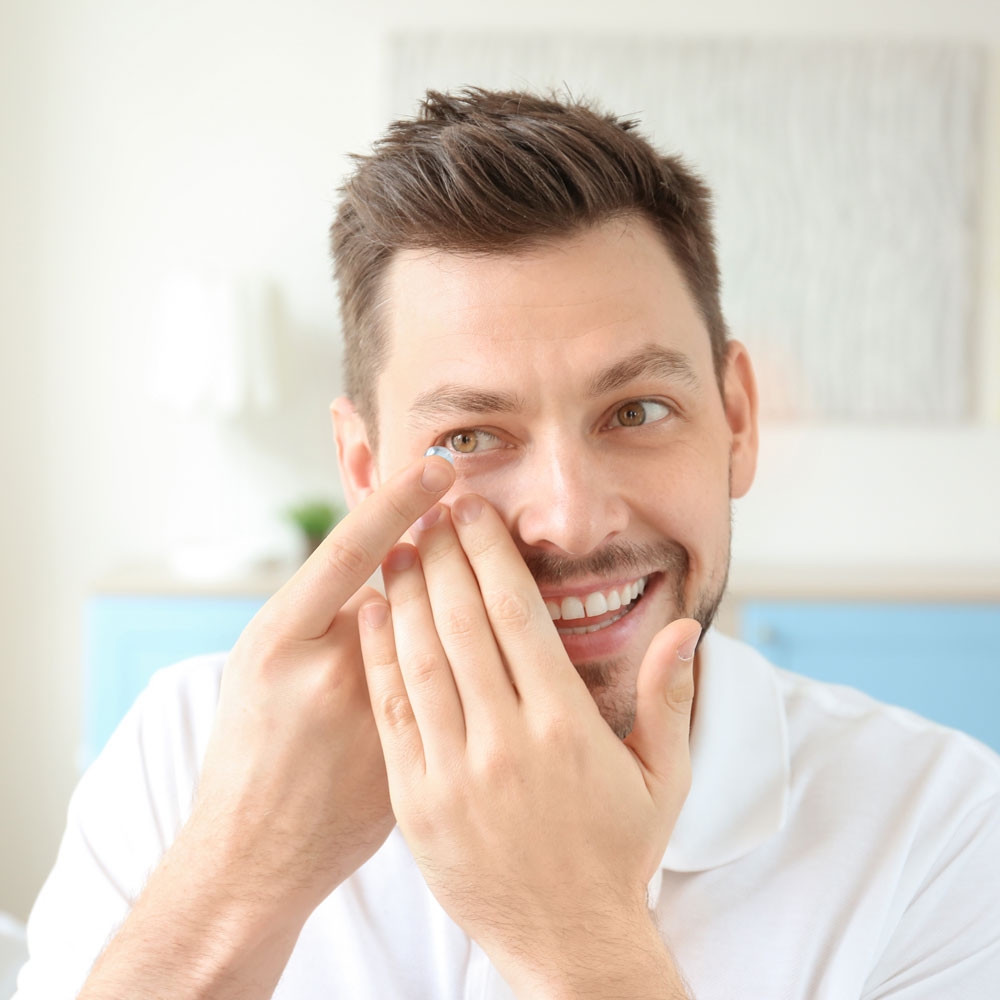 young man inserting ortho-k lenses