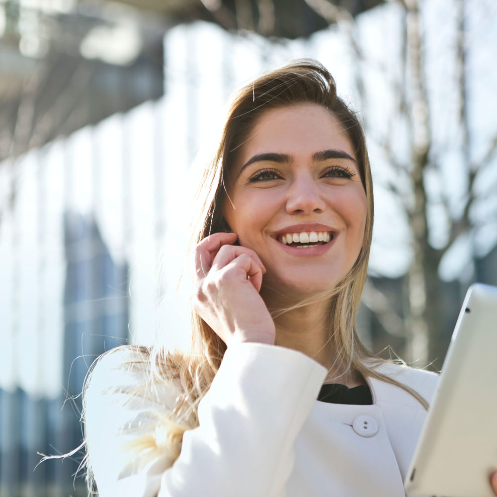 woman wearing scleral lenses talking on the phone